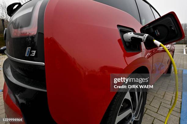 Illustration picture shows an electric BMW car with electricity charger, Monday 07 December 2020 in Bornem. BELGA PHOTO DIRK WAEM