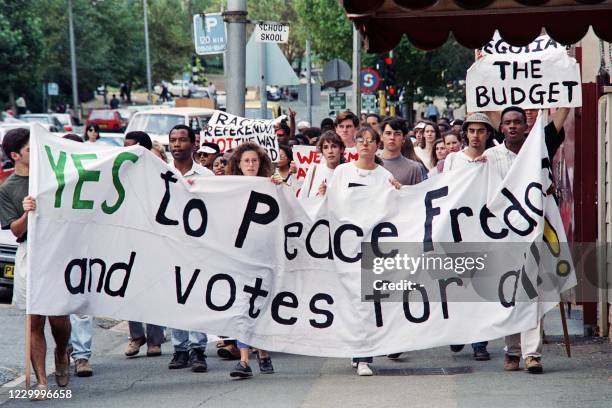 Black and white students march through Johannesburg on March 17, 1992 in support of President De Klerk's "Yes" vote for a referendum.