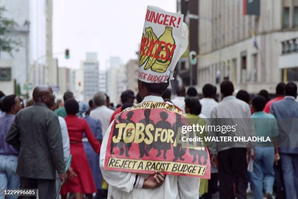 Supporters march in Johannesburg to show their support to F.W. De Klerk's victory on "Yes" referendum on March 18, 1992. - A referendum on ending...