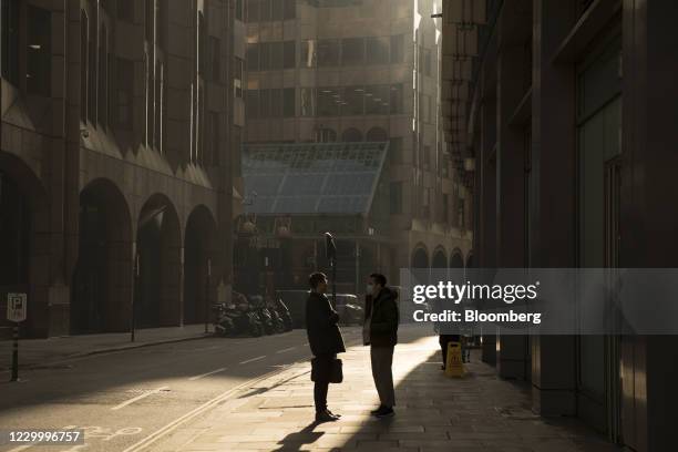 Pedestrians stop to talk in the City of London, U.K., on Monday, Dec. 7, 2020. As the U.K.'s second lockdown, lifts City of London firms are likely...