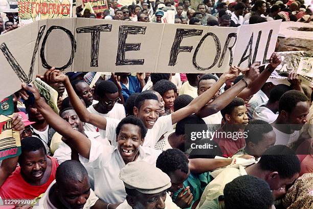 Supporters carry a "Vote for all" banner during a "People's referendum" march in Pretoria supporting F.W. De Klerk's victory on "Yes" referendum on...