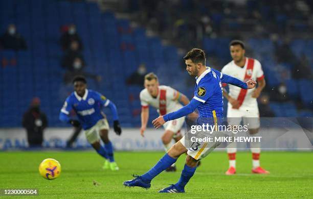 Brighton's German midfielder Pascal Gross shoots from the penalty spot to score his team's opening goal during the English Premier League football...