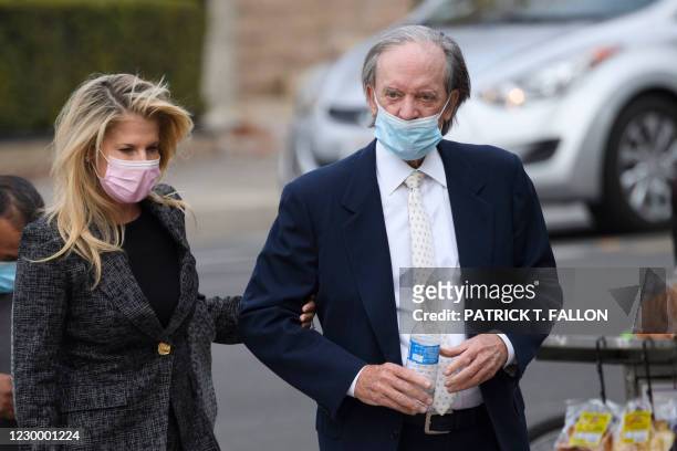 Bill Gross , founder of investment company PIMCO, and partner Amy Schwartz arrive for a court hearing in Santa Ana, California, December 7, 2020. -...