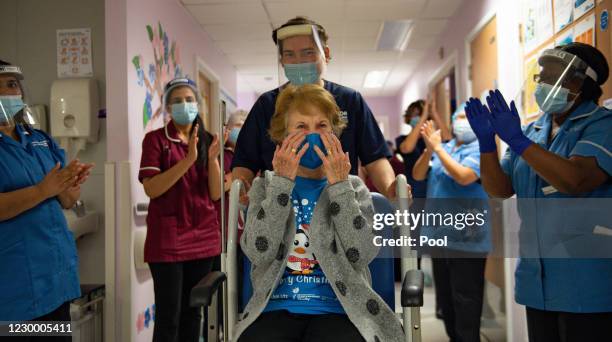 Margaret Keenan is applauded by staff as she returns to her ward after becoming the first person in the United Kingdom to receive the Pfizer/BioNtech...