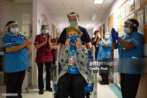 Margaret Keenan is applauded by staff as she returns to her ward after becoming the first person in the United Kingdom to receive the Pfizer/BioNtech...