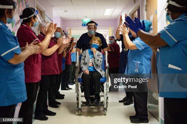 Margaret Keenan is applauded by staff as she returns to her ward after becoming the first person in the United Kingdom to receive the Pfizer/BioNtech...
