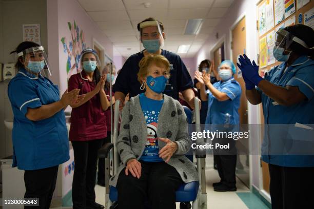 Margaret Keenan is applauded by staff as she returns to her ward after becoming the first person in the United Kingdom to receive the Pfizer/BioNtech...