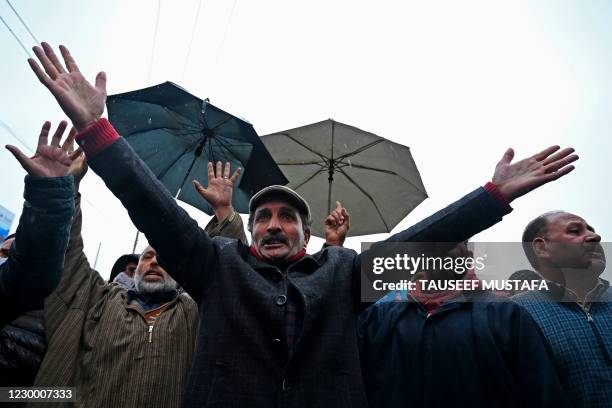 Supporters of Communist Party of India shout slogans as they support a nationwide general strike called by farmers to protest against the recent...