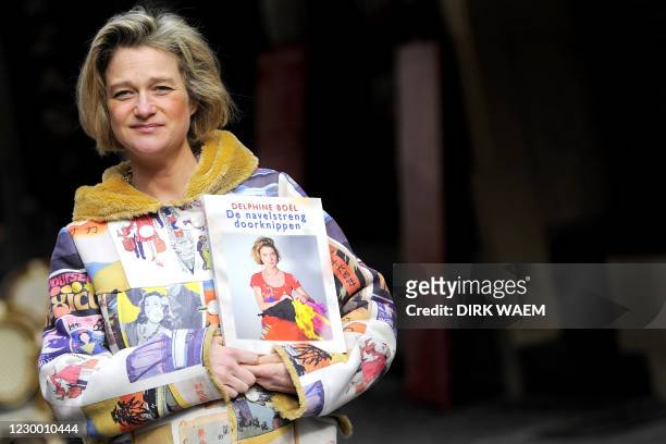Pregnant Delphine Boel poses with her new book called "Couper le cordon / De navelstreng doorknippen", , an autobiography through her works, on April...