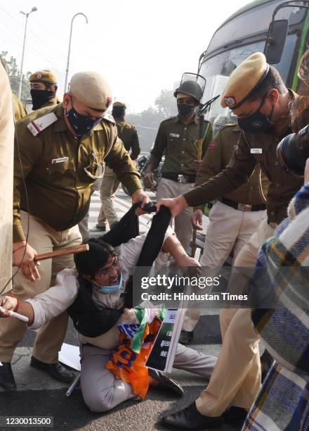 Police officials beat up an Indian Youth Congress worker for interrupt a bus service in the wake of Bharat Bandh called by farmers against new farm...