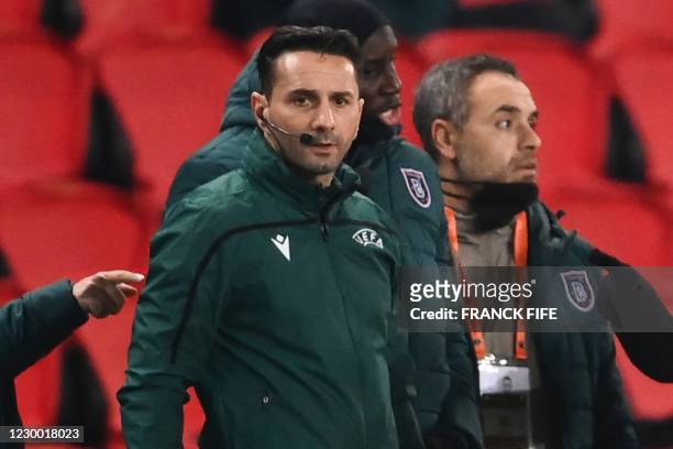 Romanian 4th referee Sebastian Coltescu looks on during the UEFA Champions League group H football match between Paris Saint-Germain and Istanbul...