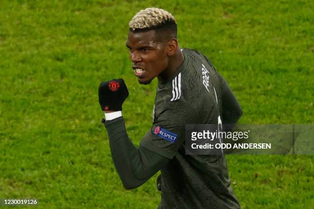 Manchester United's French midfielder Paul Pogba celebrates scoring the 3-2 goal during the UEFA Champions League Group H football match RB Leipzig v...