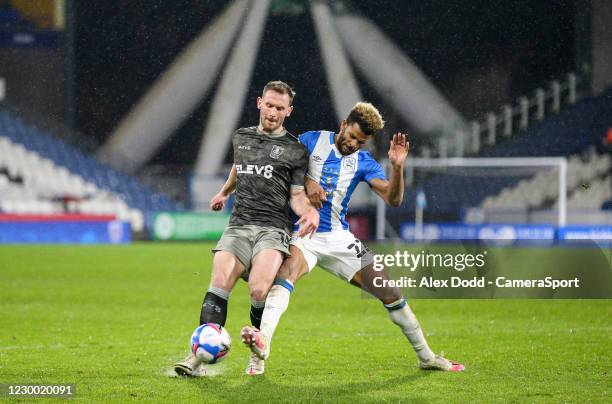 Sheffield Wednesday's Tom Lees vies for possession with Huddersfield Town's Fraizer Campbell during the Sky Bet Championship match between...