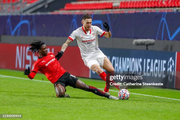 Eduardo Camavinga of Stade Rennais FC challenges Lucas Ocampos of Sevilla FC during the UEFA Champions League Group E stage match between Stade...