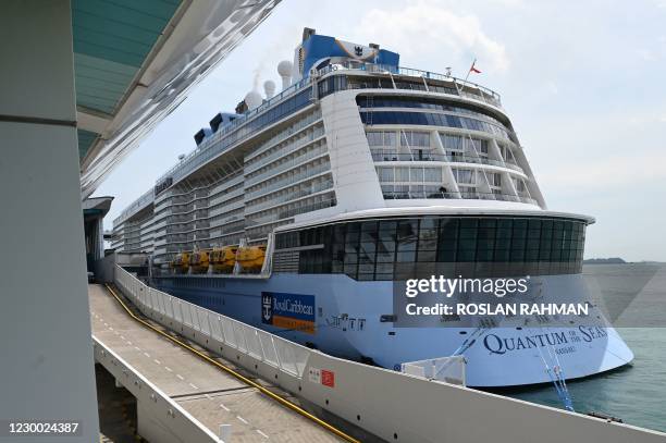 The Royal Caribbean cruise ship Quantum of the Seas is seen docked at Marina Bay Cruise Centre in Singapore on December 9 after a passenger onboard...