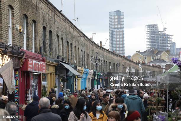Columbia Road Flower Market busy with shoppers on 6th of December 2020 in Hackney, London, United Kingdom. The flower market in East London is on all...