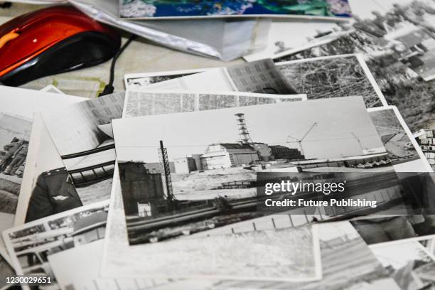 Black and white photo taken during the response effort to the 1986 Chornobyl nuclear disaster lies on the table during an interview of Chornobyl...