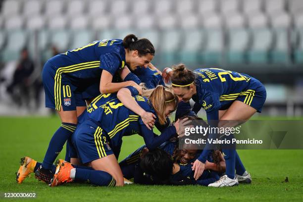 Saki Kumagai of Olympique Lyonnais Women celebrates a goal with team mates during the UEFA Women's Champions League round of 32 first leg match...
