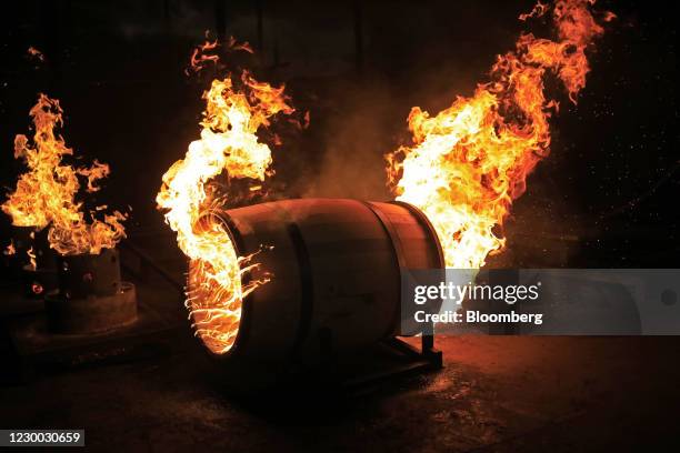 White oak bourbon barrels are charred at Kelvin Cooperage in Louisville, Kentucky, U.S., on Tuesday, Dec. 8, 2020. Indexes of manufacturing...