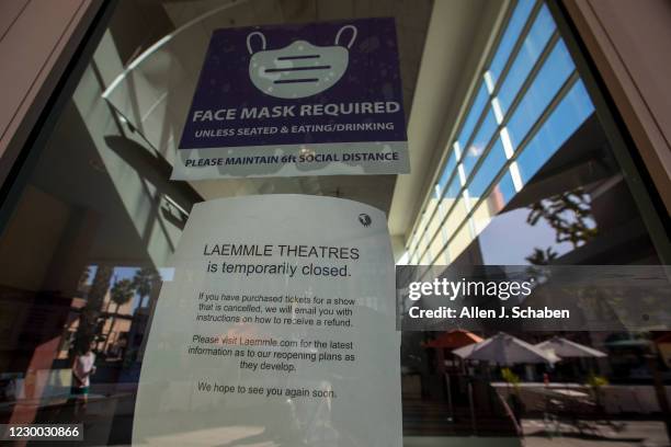 Closed sign is posted on the Laemmle Theatre on Colorado Blvd. Where several businesses have closed and many struggle to stay open during California...