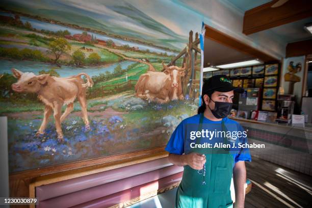 Konstantinos Varelas, Golden Ox Burger manager, holds his stress beads while working at the restaurant on Main Street in El Monte where many...