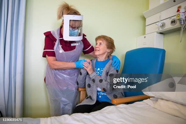 Margaret Keenan the first patient in the United Kingdom to receive the Pfizer/BioNtech covid-19 vaccine, speaks with Healthcare assistant Lorraine...