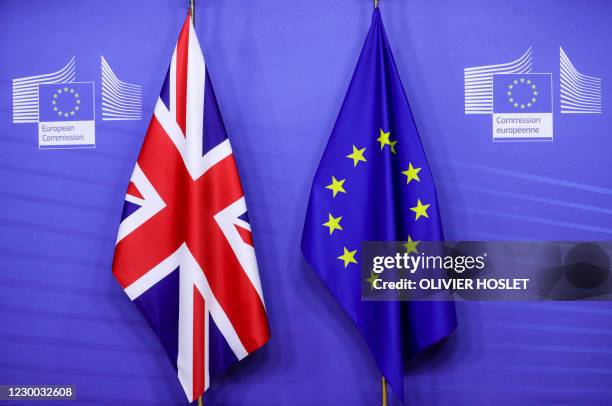 This picture taken on December 9 shows flags of the Union Jack and the EU ahead of Britain's Prime Minister's meeting on post Brexit trade deal with...