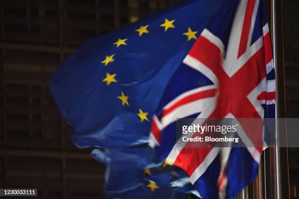 National flag flies beside European Union flags outside the Berlaymont building in Brussels, Belgium, on Wednesday, Dec. 9, 2020. Boris Johnson is...