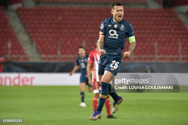 Porto's Brazilian midfielder Otavio celebrates after scoring a goal during the UEFA Champions League Group C football match between Olympiakos and FC...