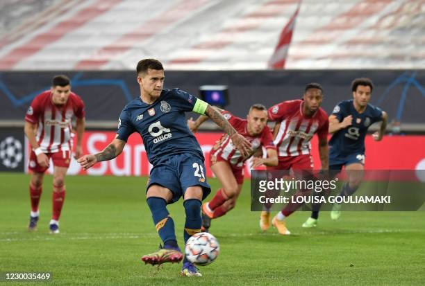 Porto's Brazilian midfielder Otavio takes a penalty kick and scores a goal during the UEFA Champions League Group C football match between Olympiakos...