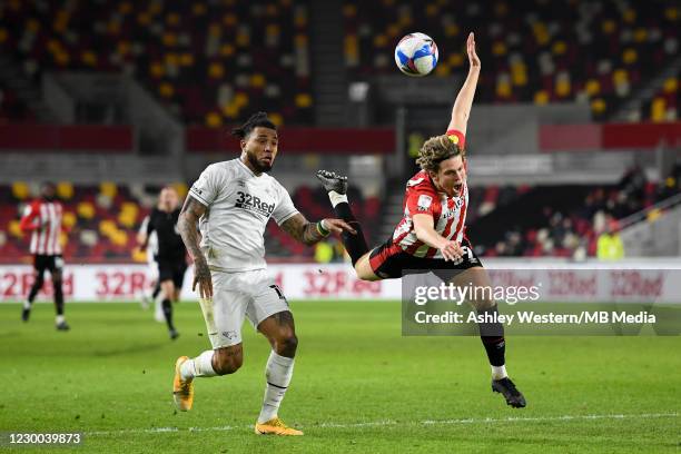 Derby County's Colin Kazim-Richards battles with Brentford's Mads Bech Sorensen during the Sky Bet Championship match between Brentford and Derby...