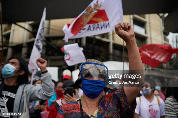 Protesters march to commemorate international human rights day on December 10, 2020 in Manila, Philippines. Human rights group decry the continued...