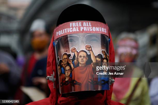 Protesters march to commemorate international human rights day on December 10, 2020 in Manila, Philippines. Human rights group decry the continued...