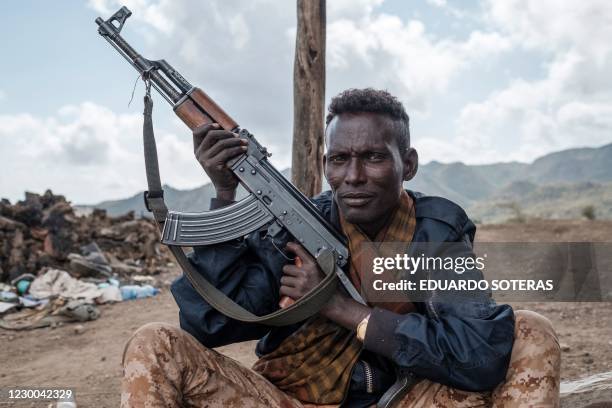 Member of the Afar Special Forces poses with his weapon in the outskirts of the village of Bisober, Tigray Region, Ethiopia, on December 09,...