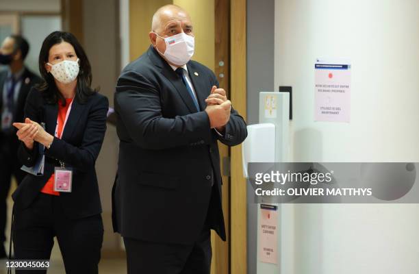 Bulgaria's Prime Minister Boyko Borisov uses hand sanitizer as he arrives for a round table meeting at an EU summit at the European Council building...