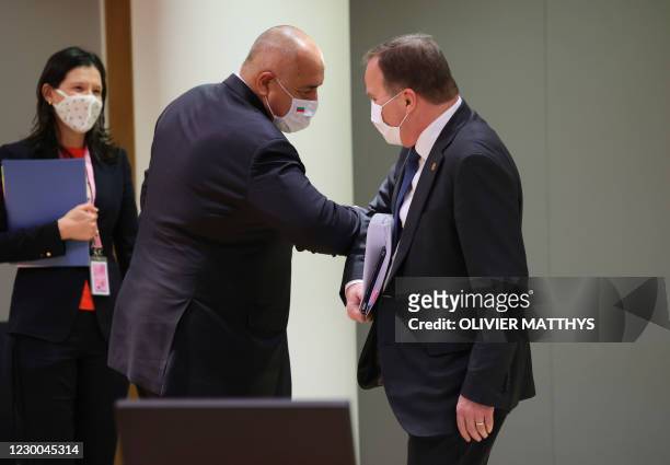 Bulgaria's Prime Minister Boyko Borissov greets Sweden's Prime Minister Stefan Lofven, right, with an elbow bump during a round table meeting at an...