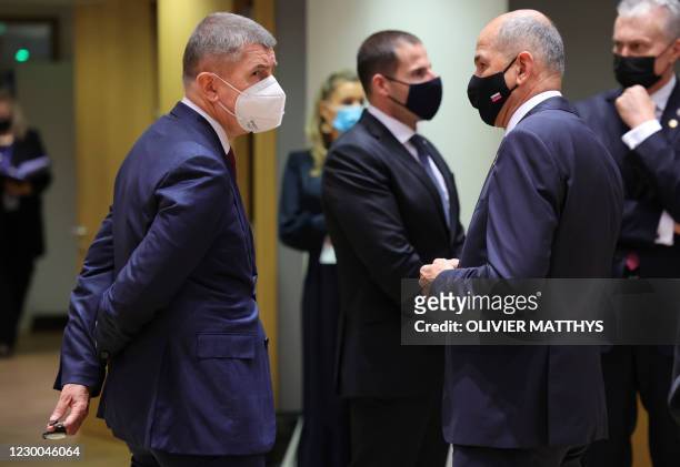 Czech Republic's Prime Minister Andrej Babis speaks with Slovenia's Prime Minister Janez Jansa during a round table meeting during an EU summit at...
