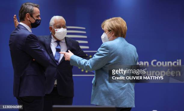 German Chancellor Angela Merkel speaks with Portugal's Prime Minister Antonio Costa and Greek Prime Minister Kyriakos Mitsotakis prior to a round...