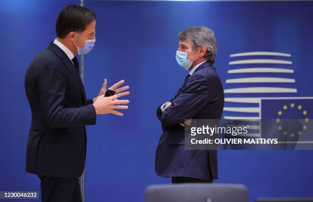 Dutch Prime Minister Mark Rutte, left, speaks with European Parliament President David Sassoli during a round table meeting during an EU summit at...