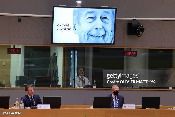 French President Emmanuel Macron and Slovenia's Prime Minister Janez Jansa watch a video in tribute late French President Valery Giscard d'Estaing...