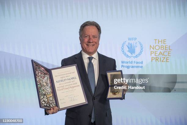 In this handout photo provided by WFP, David Beasley, Executive Director of the United Nations World Food Programme poses with the Nobel Peace Prize...