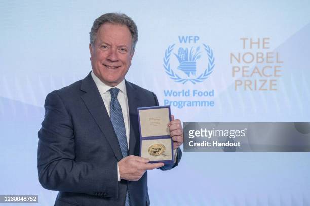 In this handout photo provided by WFP, David Beasley, Executive Director of the United Nations World Food Programme poses with the Nobel Peace Prize...