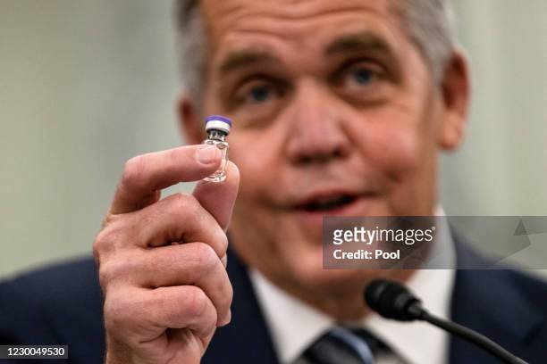Wesley Wheeler, President of Global Healthcare at United Parcel Service , holds up a sample of the vial that will be used to transport the Pfizer...