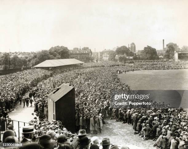 Huge Bank Holiday crowd limited the playing area during the County Championship match between Surrey and Nottinghamshire at the Kennington Oval in...