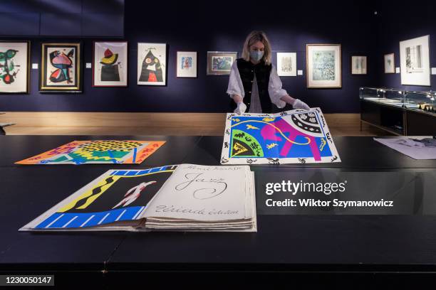 Staff member presents a book by Henri Matisse Jazz, Tériade, Paris, 1947 the set of 20 pochoirs in colours during a photo call for Bonhams' Prints &...