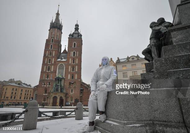 An activist wearing the personal protective equipment suit, seen ahead of an anti-vaccine, anti-restrictions and against social conformity march...