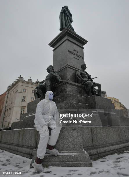 An activist wearing the personal protective equipment suit, seen ahead of an anti-vaccine, anti-restrictions and against social conformity march...