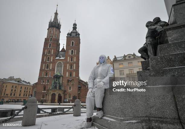 An activist wearing the personal protective equipment suit, seen ahead of an anti-vaccine, anti-restrictions and against social conformity march...