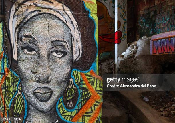 Graffitti colors the alleways in the Roupa Suja area in Favela da Rocinha on December 9, 2020 in Rio de Janeiro, Brazil. Rocinha is the largest...