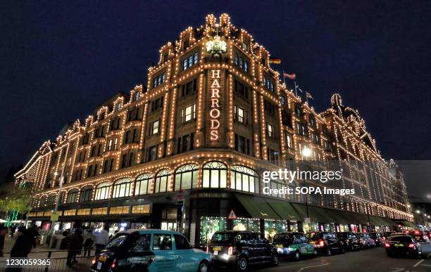 The iconic facade of Harrods all lit up. World Famous Knightsbridge Department store Harrods is all lit up and decorated for Christmas.